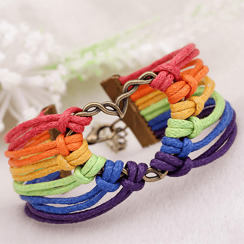Woven heart bracelet with multi-color rope and a heart shaped centerpiece